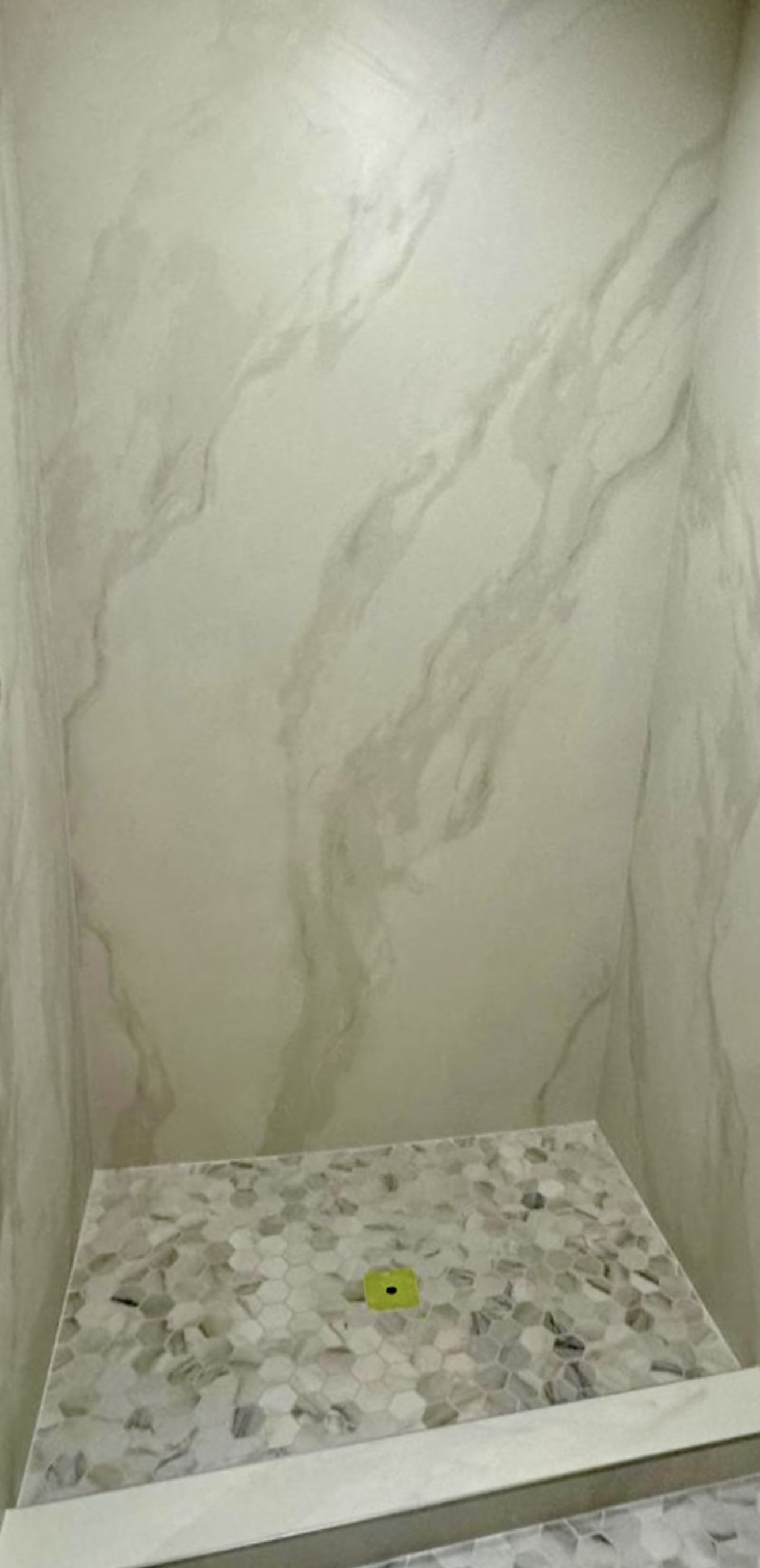 Large-format porcelain panel installation using three full-height panels